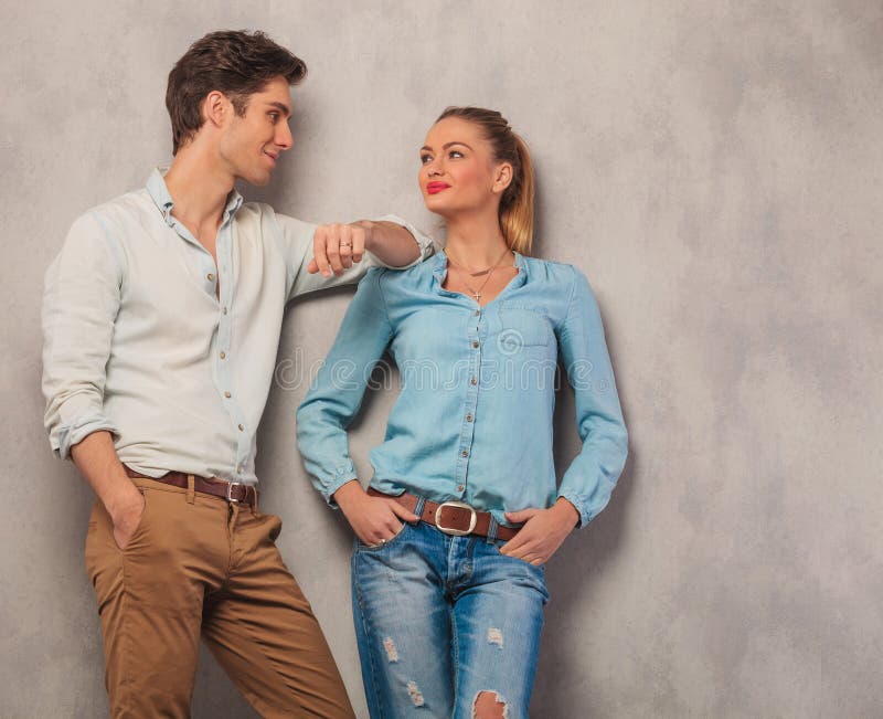 Man Lean On His Girl Shoulder While She Poses With Hands In Pock Stock Image Image Of Couple