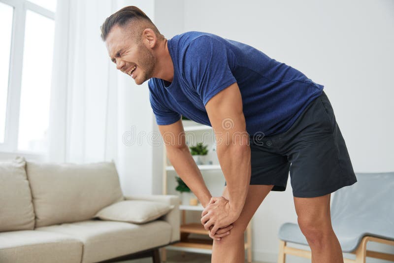 Man leg pain from exercising at home, workout injury, muscle and ligament sprain, bruise. High. Man exercised stock images, royalty-free photos and pictures