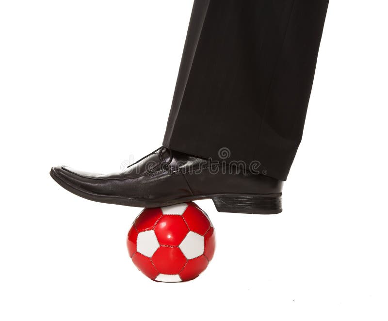 Man leg in suit with soccer ball