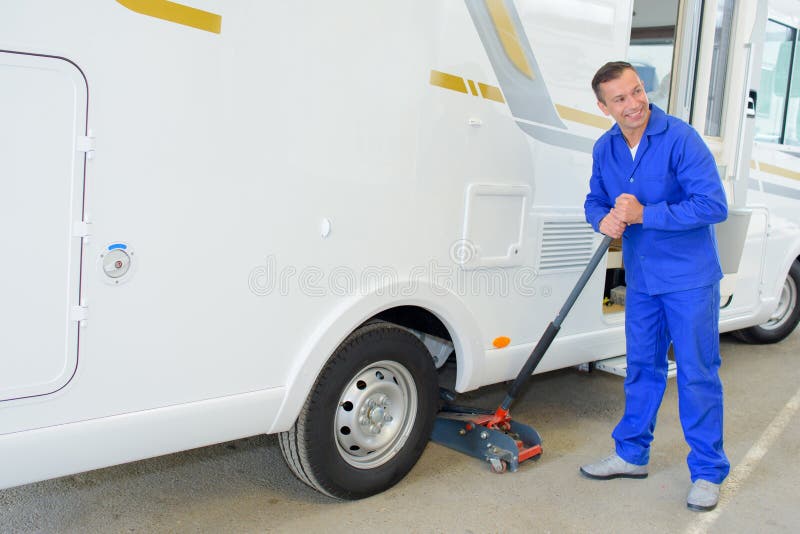 Man lifting camper van stock photo. Image of camper 197178602