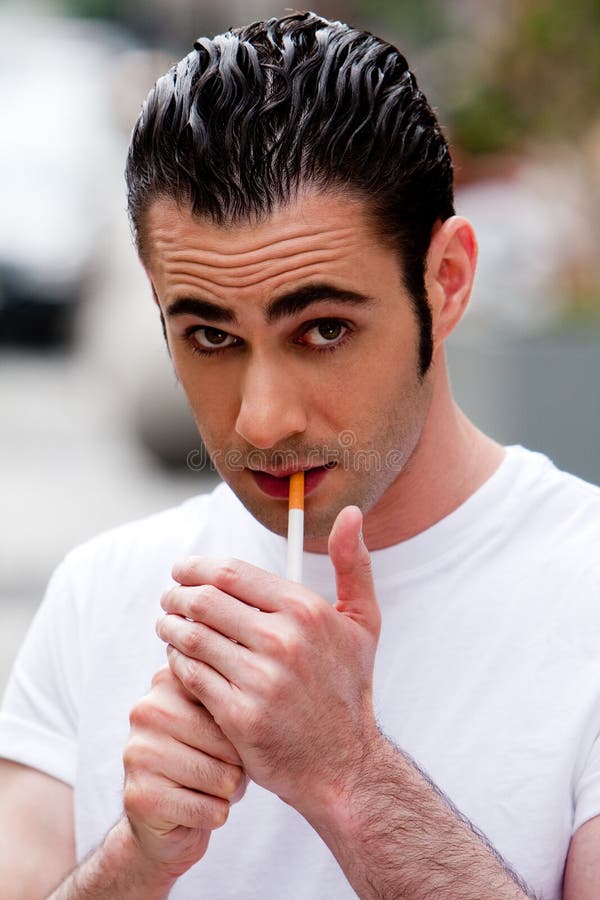 Man lighting cigarette stock photo. Image of handsome 9799220