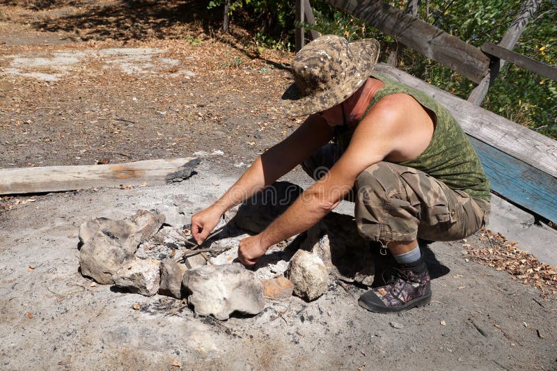 Lighting the Fire in the Cabin Chimney Using Logs Stock Photo Image