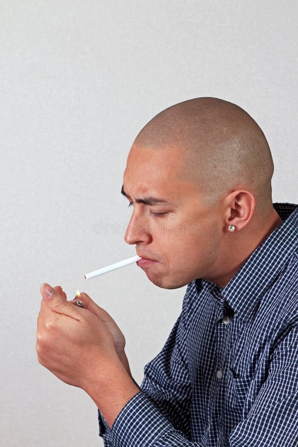 Man Lights a Cigarette stock image. Image of disease 22440955