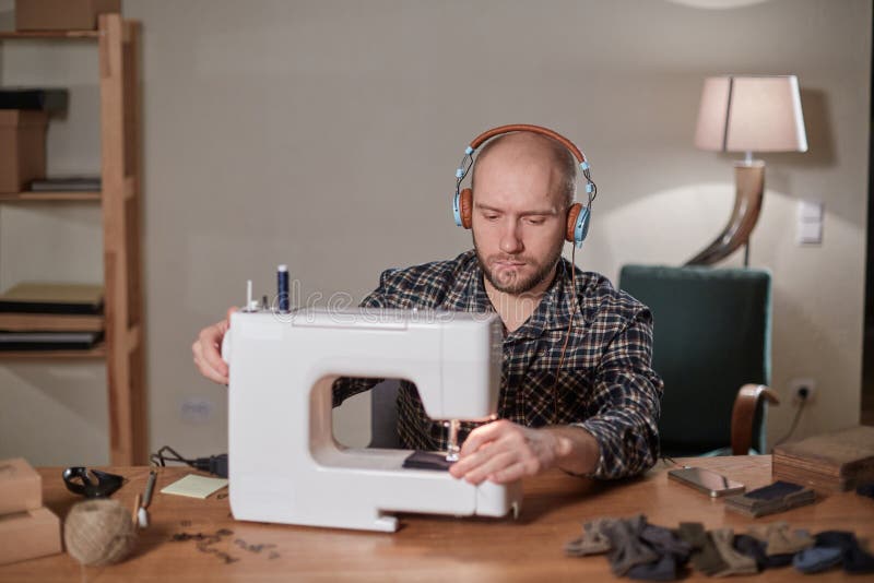 Tailor Makes Bow Ties of Woolen Fabric. Work with Sewing Machine in a