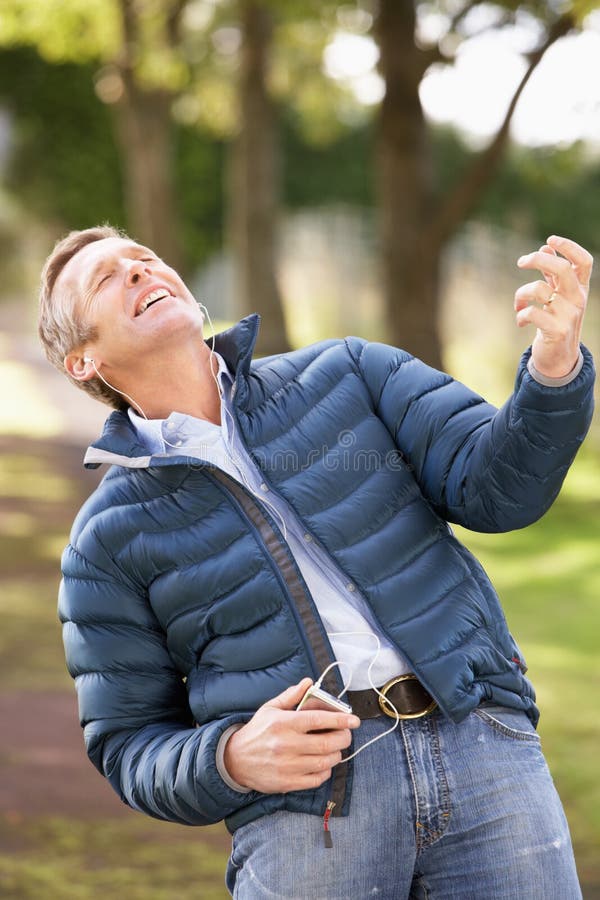 Man Listening To MP3 Whilst Walking