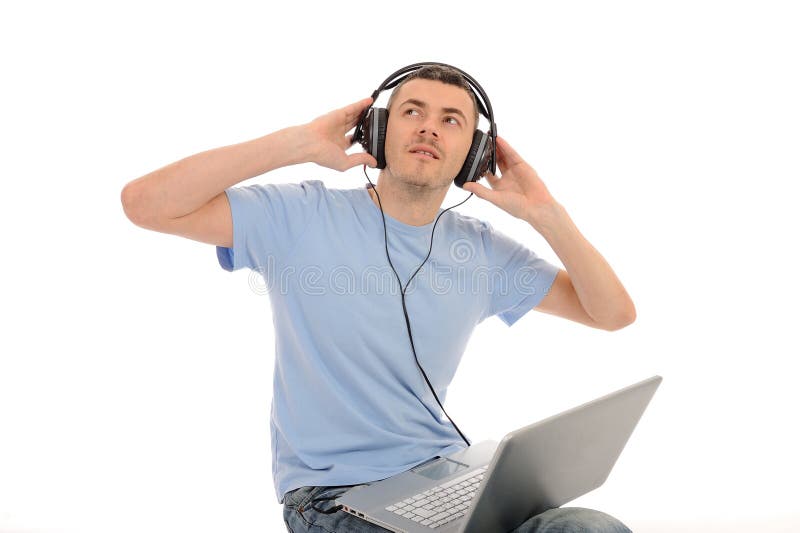 Man listening to music in headphones on computer