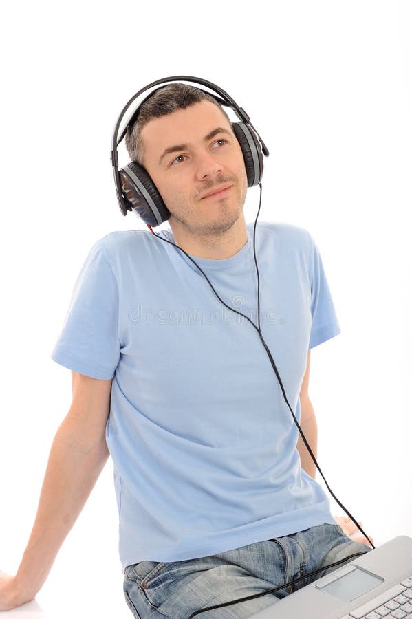 Man listening to music in headphones from computer