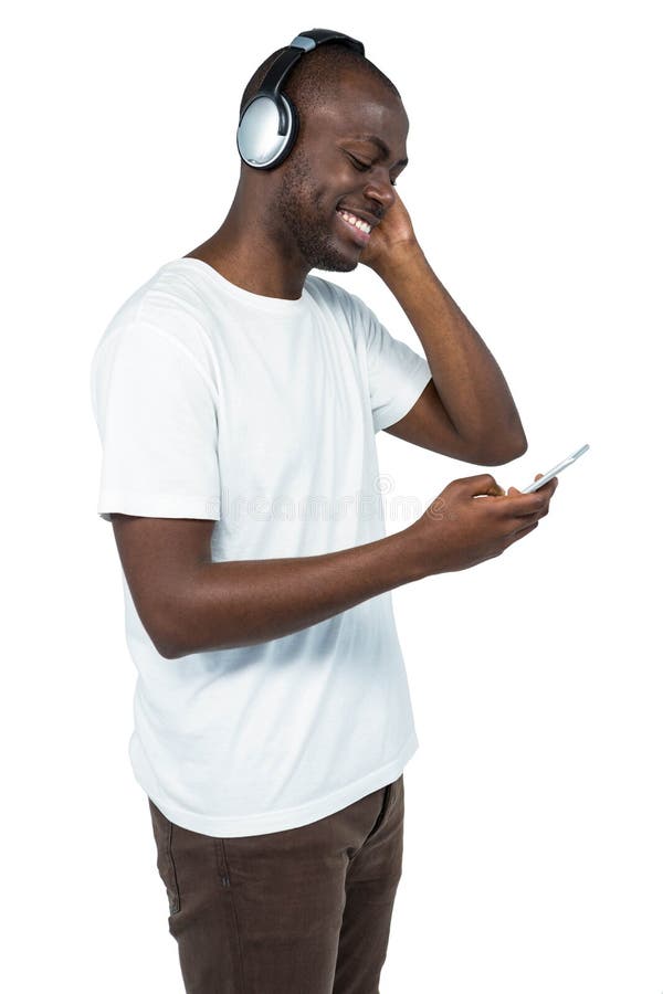 Man listening to music on mobile phone royalty free stock image Man listening to music on mobile phone royalty free stock image