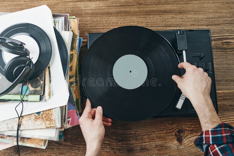 Man Listening Music from Vinyl Record. Playing Music from Analog Disk on Turntable Player. Enjoying Music from Old Collection Stock Image - Image of analog, audio: 249366025