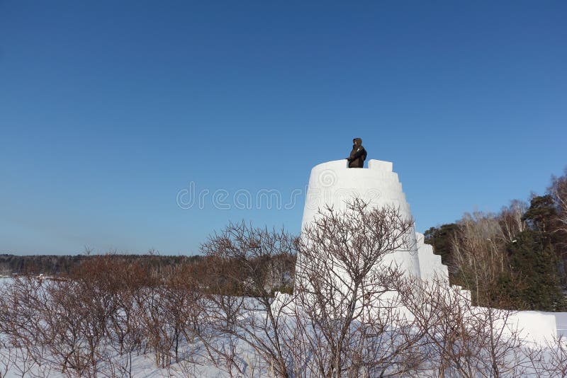 Man looking into the distance from the top of a snow fortress, Siberia, Russia stock photo Man looking into the distance from the top of a snow fortress, Siberia, Russia stock photo