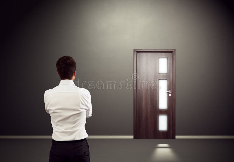 Man looking at the door stock photo. Image of entrance 31924954