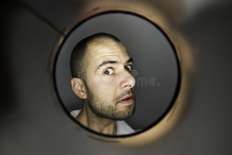 Man looking at a hole