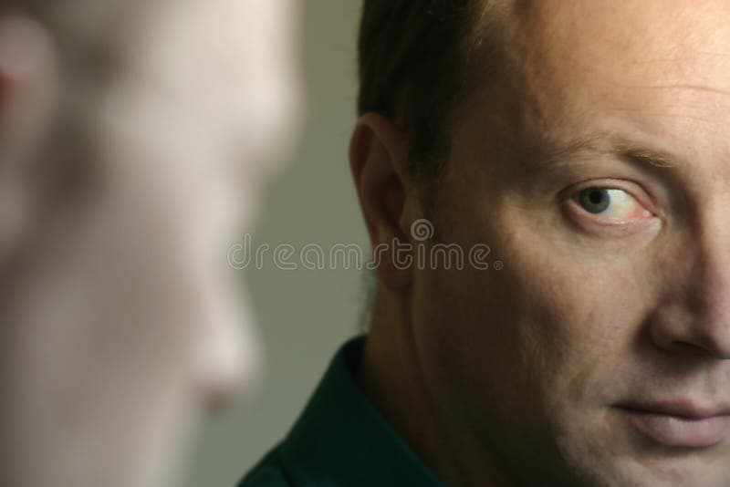 Man Looking in Mirror royalty free stock image