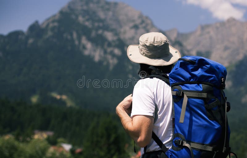 Man looking at the mountains