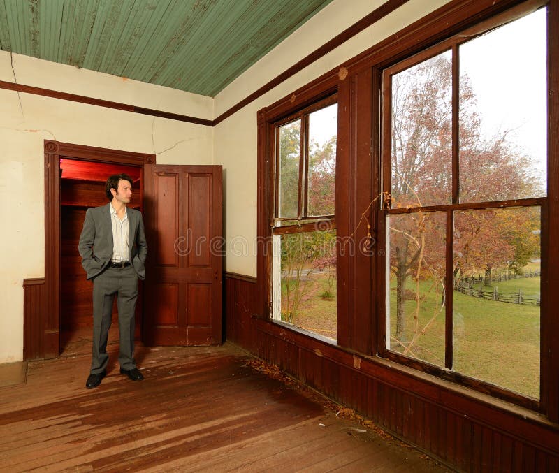 Man Looking out the Window