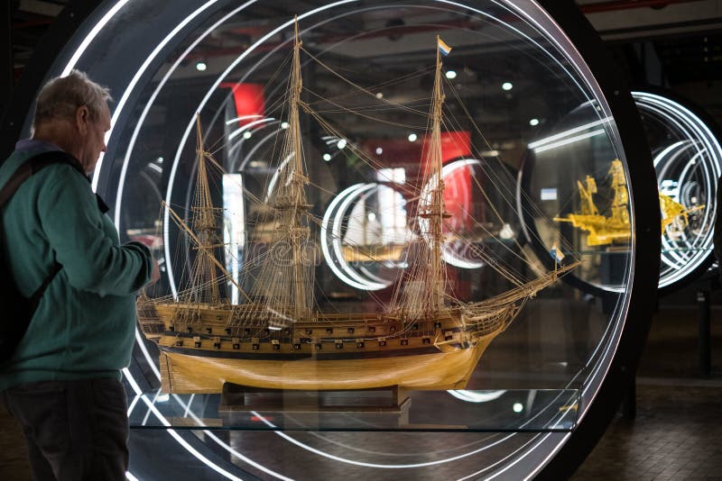 Man looking at sailing ship model inside the German Museum of T stock photography Man looking at sailing ship model inside the German Museum of T stock photography