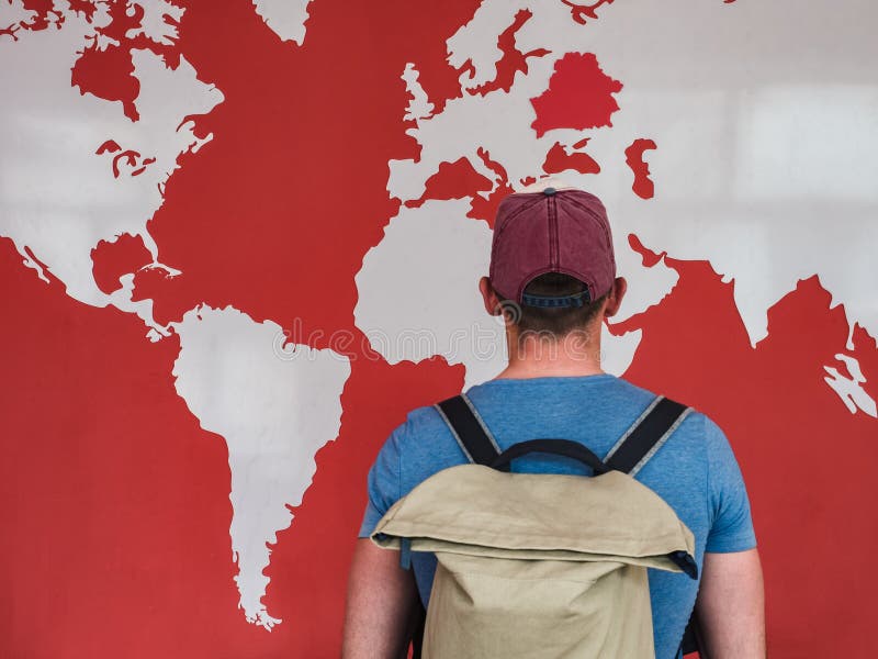 Man looking at the world map stock images Man looking at the world map stock images