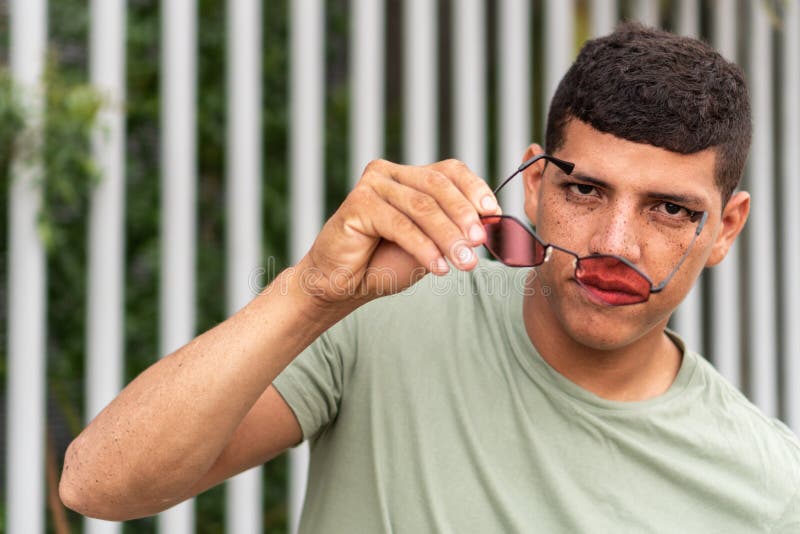 Man Lowering His Sunglasses in the Park Stock Photo Image of model