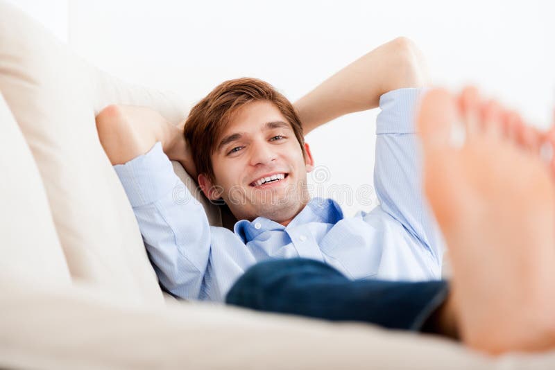 Man lying down on sofa