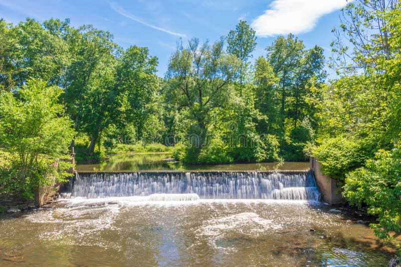 A man-made waterfall surrounded by trees in Stony Brook in Suffield, Connecticut. Man made waterfall stock images, royalty-free photos and pictures