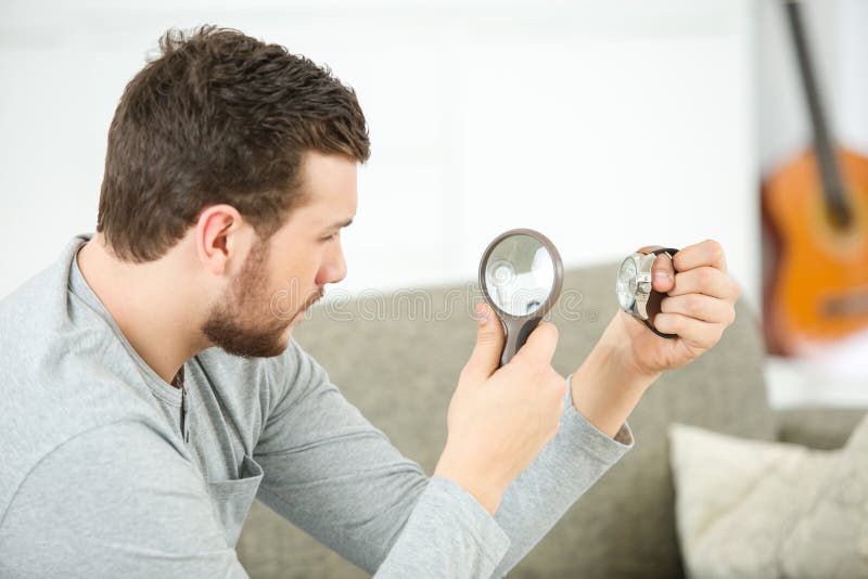 Man with magnifying glass royalty free stock photography Man with magnifying glass royalty free stock photography