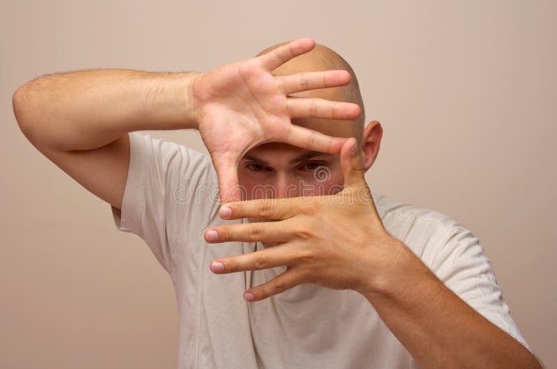Man making frame with his hands royalty free stock images