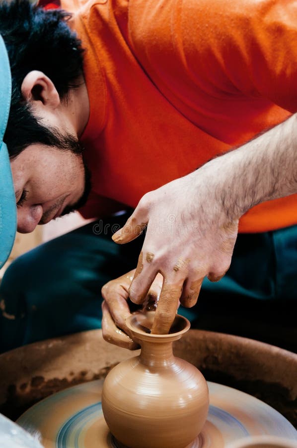 Man making pottery art, clay work close up hands shot shot Stock