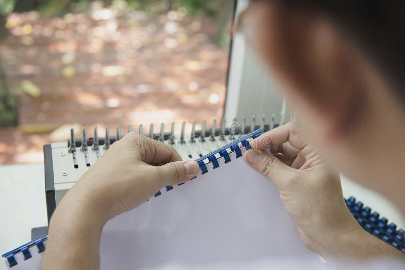 Man Making Report Using Comb Binding Machine Stock Photo Image of
