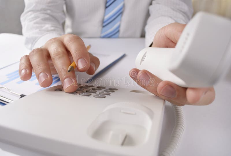 Man making a telephone call on a landline