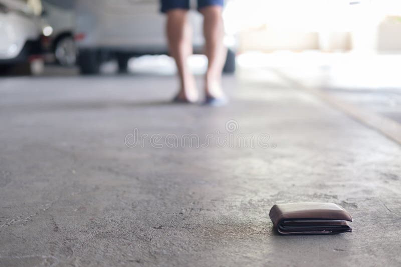 wallet fall at car park. royalty free stock image wallet fall at car park. royalty free stock image