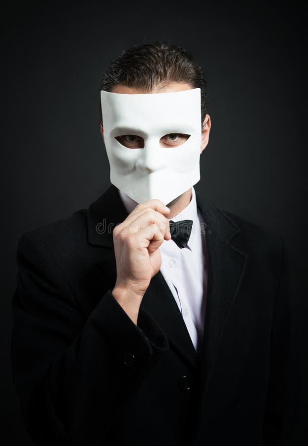 Mystery Man in Black Mask Holding White Masks Stock Image - Image of crime,  depression: 132747899