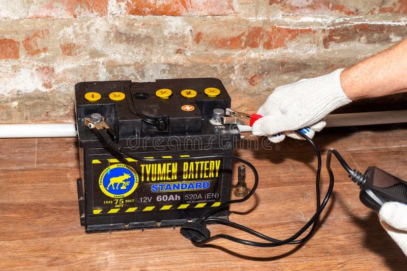 A Man Measures the Capacity and Current of a Car Battery with a