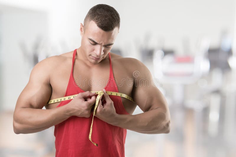 Fitness, biceps and man with measuring tape on arm, check muscle growth and  development in training exercise. Workout, gym and happy healthy  bodybuilder measuring bicep muscles, health and wellness. Photos