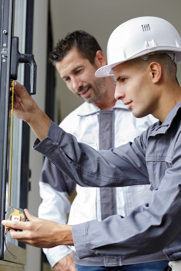 Man Measuring Window Prior To Installation Stock Photo Image of