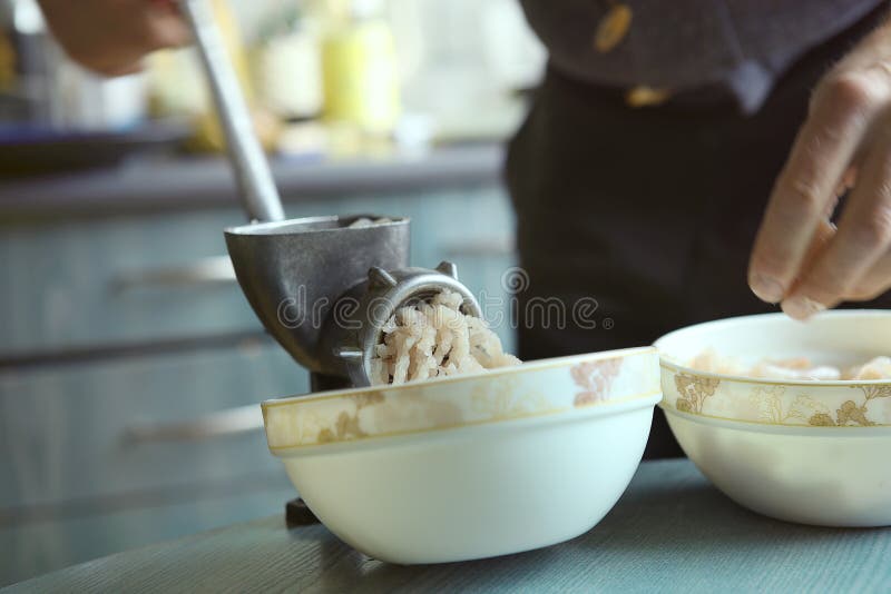Man Mincing Fish with Grinder. Stock Image Image of machine, table