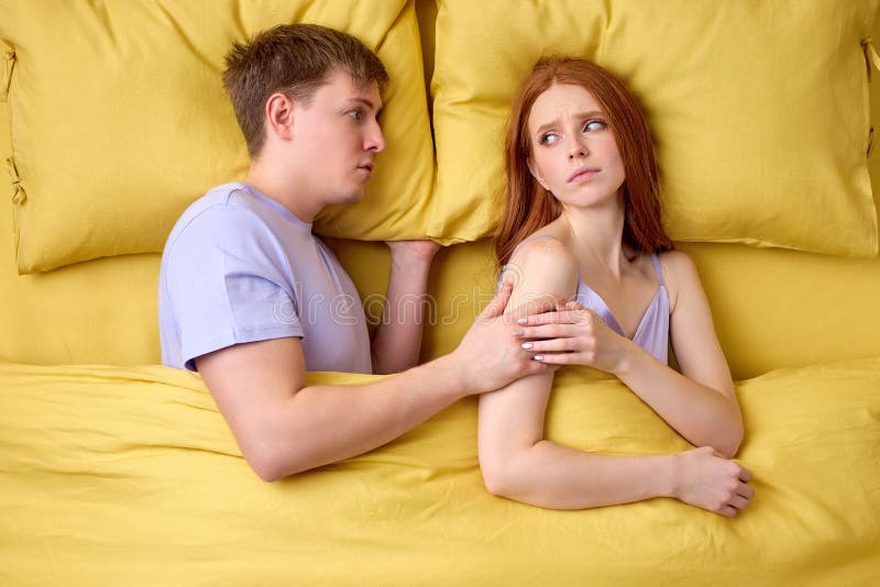 Man Misunderstanding Why Wife Does Not Want Sex with Him Stock Photo