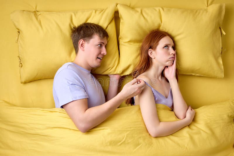 Man Misunderstanding Why Wife Does Not Want Sex with Him Stock Image pic