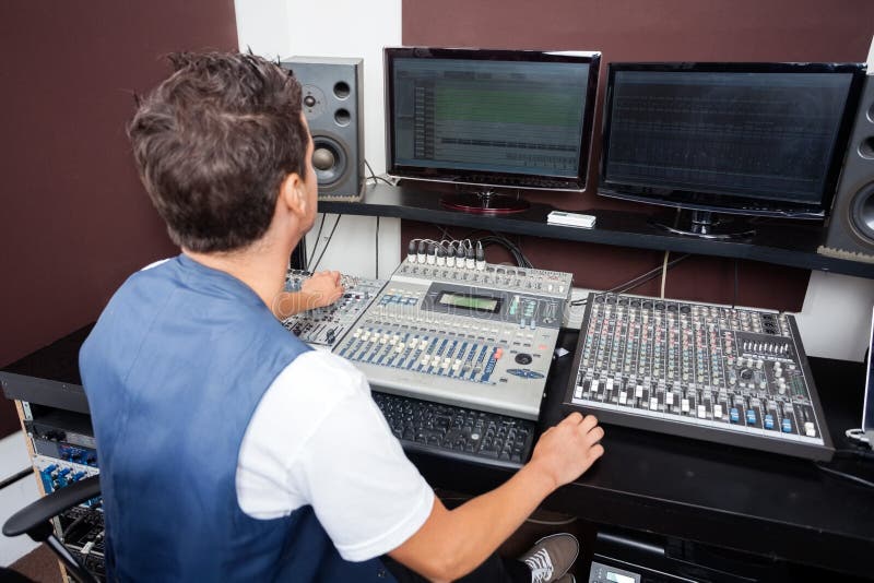 Man Mixing Audio in Recording Studio Stock Image Image of casual, console 61839489