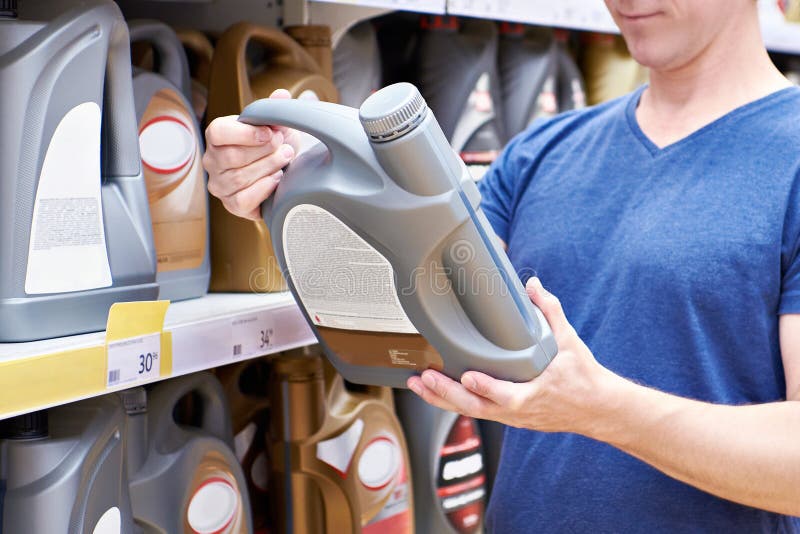 Man with Motor Oil in Store Stock Image Image of canister, person 263365275