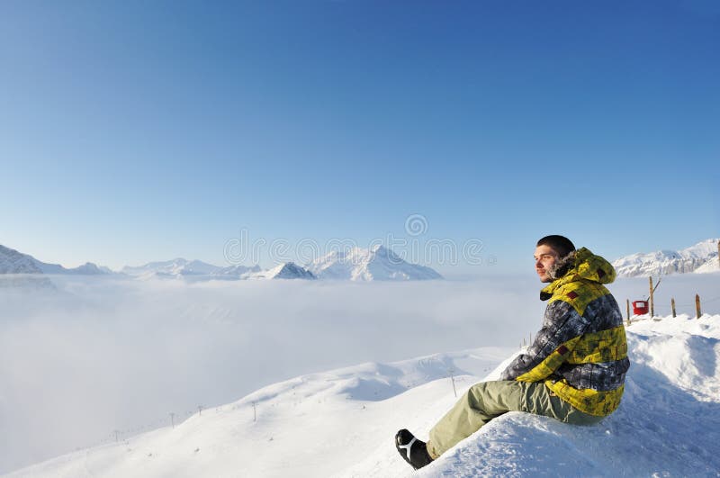 Man at mountains in clouds