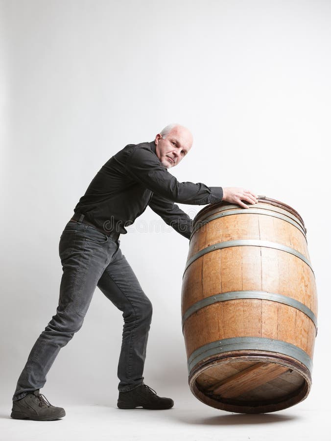 Man Moving a Large Oak Wine or Beer Barrel Stock Photo Image of arms