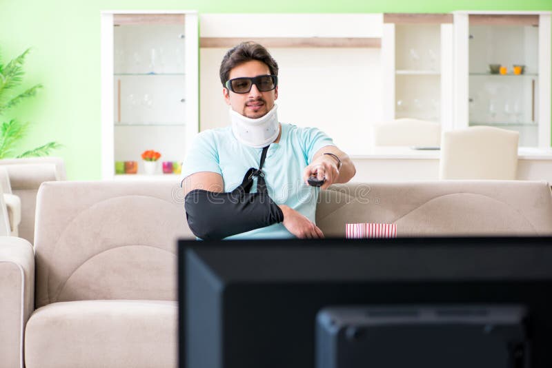 The Man with Neck and Arm Injury Watching Tv Stock Photo Image of