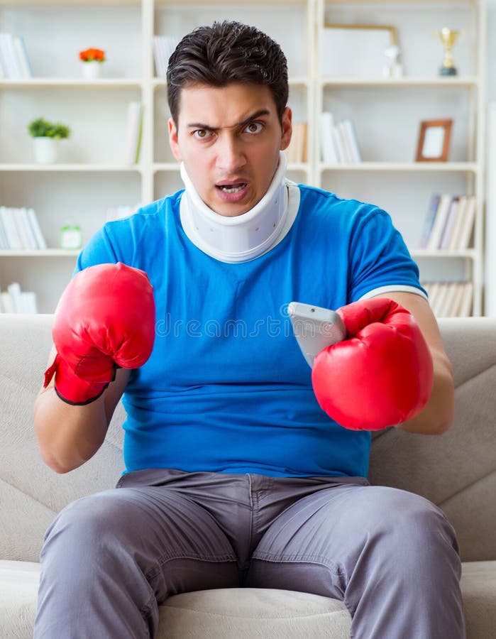 Man with Neck Injury Watching Boxing at Home Stock Photo Image of