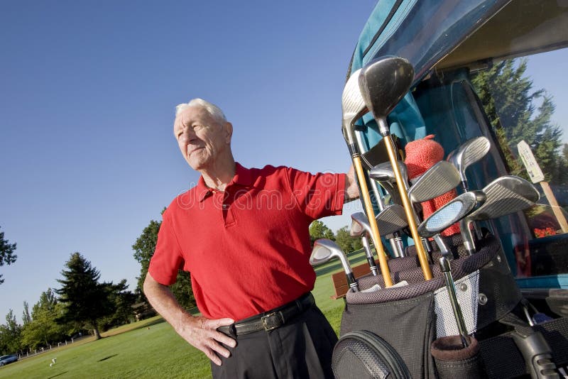 Man Next to Golf Cart Smiling