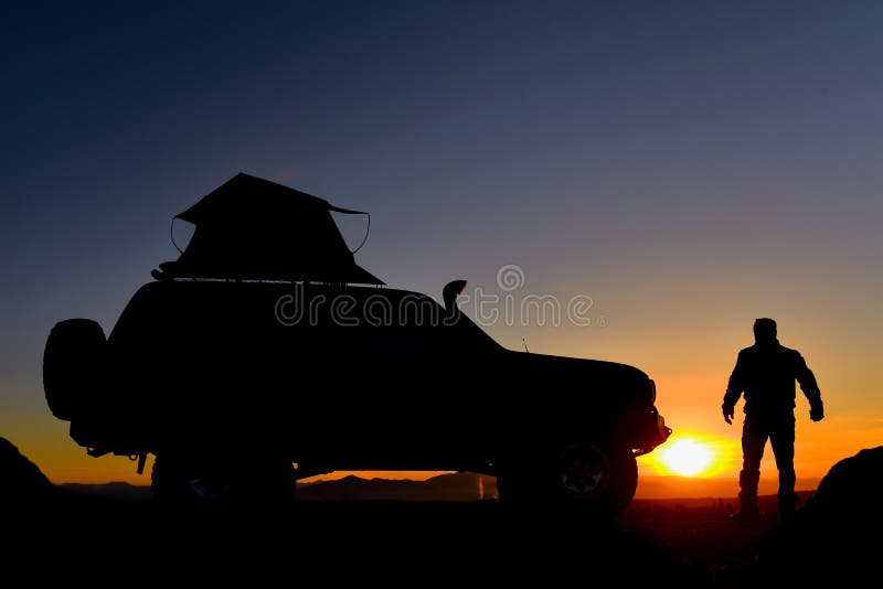 Man Next To Jeep Watching Sunset Stock Image Image of jeep, adventure