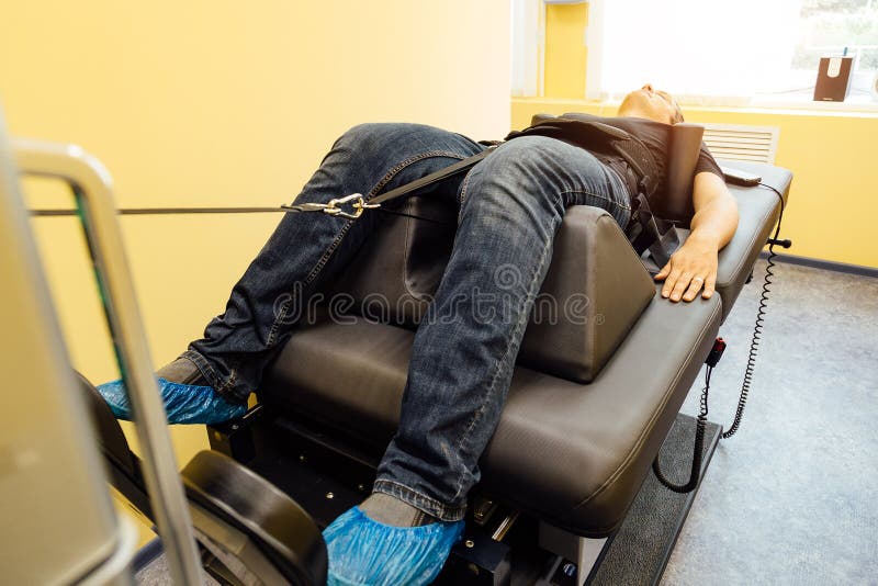 Man At Non Surgical Spinal Decompression Procedure Stock Photo Image Man At Non Surgical Spinal Decompression Procedure Stock Photo Image