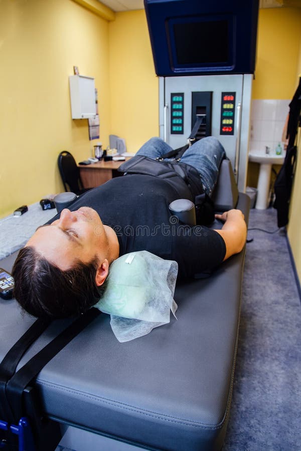 Man At Non Surgical Spinal Decompression Procedure Stock Image Image Man At Non Surgical Spinal Decompression Procedure Stock Image Image