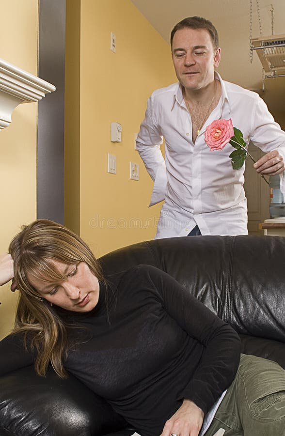 Man offering flowers to a woman