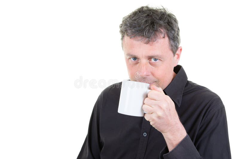 Man in office attire holding drinking coffee mug stock photography