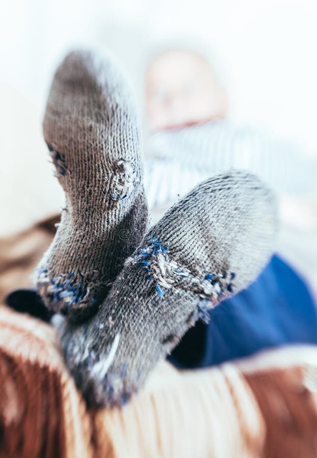 Man in old socks with holes royalty free stock photo Man in old socks with holes royalty free stock photo